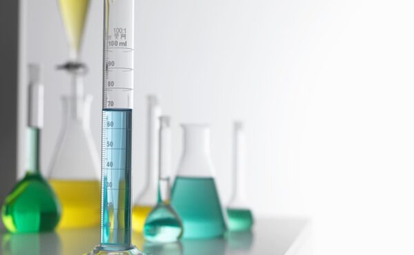 various beakers with liquid solutions different colors