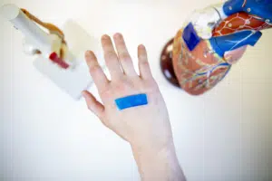 active adhesive chitosan dressing on hand